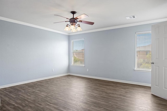 383 Spring Dr, Kyle, TX 78640 - unfurnished room with crown molding, dark wood-type flooring, a ceiling fan, and baseboards