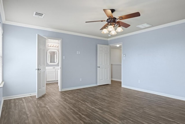 383 Spring Dr, Kyle, TX 78640 - unfurnished bedroom featuring dark wood-style flooring, crown molding, baseboards, ensuite bath, and ceiling fan