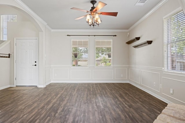 383 Spring Dr, Kyle, TX 78640 - empty room featuring wood finished floors, arched walkways, crown molding, ceiling fan, and a wainscoted wall