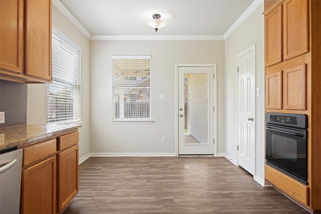 383 Spring Dr, Kyle, TX 78640 - kitchen with oven, dishwasher, dark wood-type flooring, ornamental molding, and baseboards