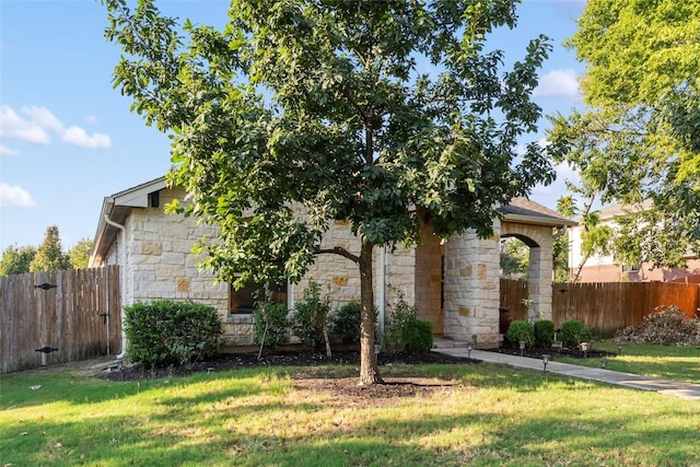 620 Allens Creek Way, Round Rock, TX 78664 - view of property hidden behind natural elements featuring stone siding