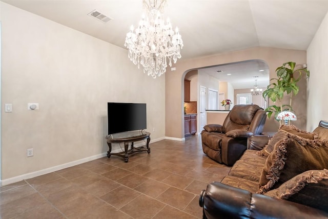 620 Allens Creek Way, Round Rock, TX 78664 - tiled living room featuring a chandelier, arched walkways, and vaulted ceiling