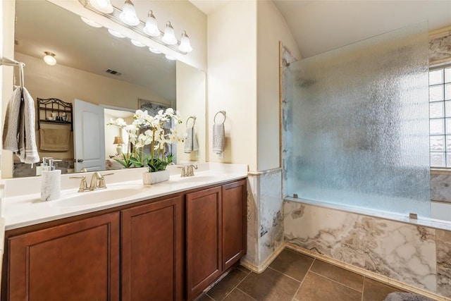 620 Allens Creek Way, Round Rock, TX 78664 - bathroom with tile patterned floors, lofted ceiling, double vanity, a shower, and a tub with marble appearance