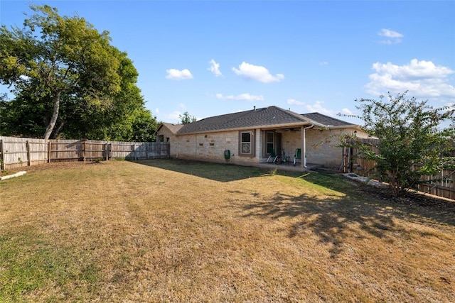 620 Allens Creek Way, Round Rock, TX 78664 - rear view of house with a fenced backyard and a patio area