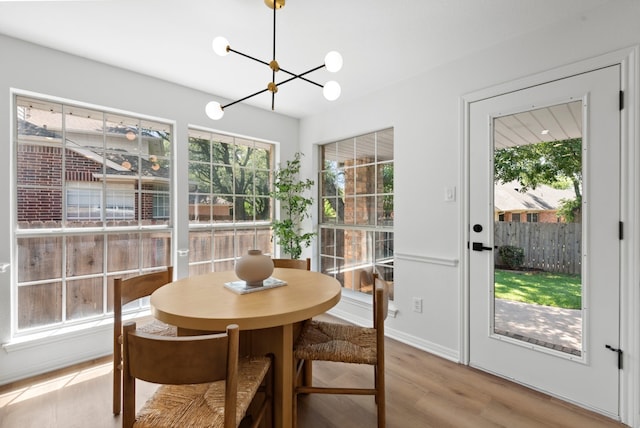 10021 Mirage Cv, Austin, TX 78717 - dining space featuring a chandelier and light wood finished floors