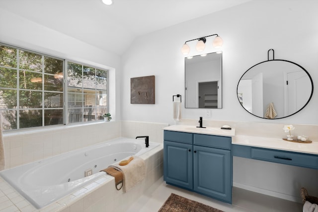 10021 Mirage Cv, Austin, TX 78717 - bathroom with vanity, vaulted ceiling, and a tub with jets