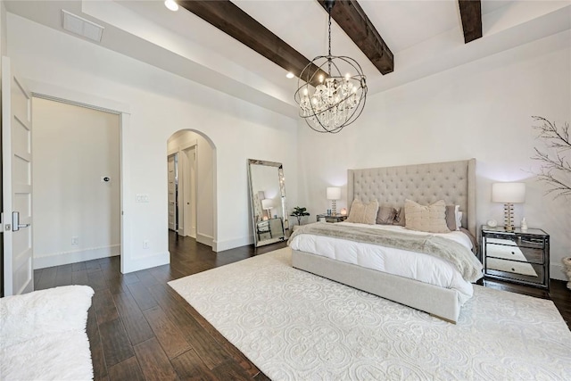 8100 Magnolia Ridge Cv, Austin, TX 78738 - bedroom with arched walkways, beam ceiling, dark wood finished floors, and a chandelier
