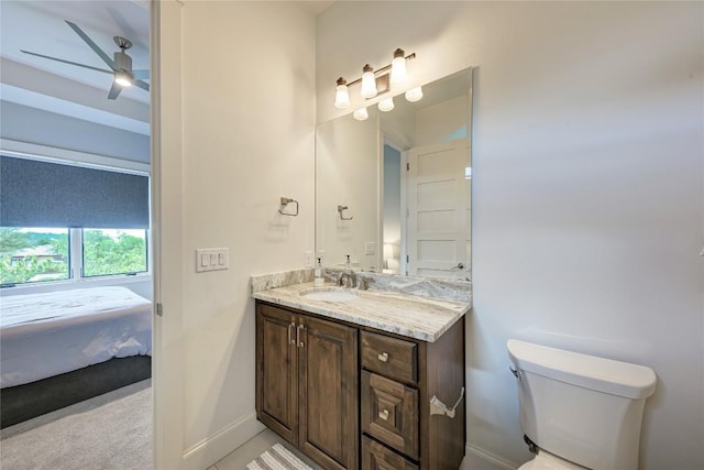 8100 Magnolia Ridge Cv, Austin, TX 78738 - bathroom featuring vanity, toilet, a ceiling fan, ensuite bathroom, and baseboards