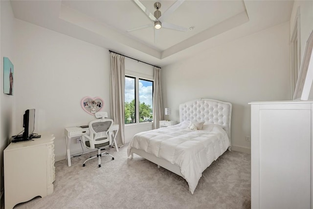 8100 Magnolia Ridge Cv, Austin, TX 78738 - bedroom with a raised ceiling, light carpet, and baseboards