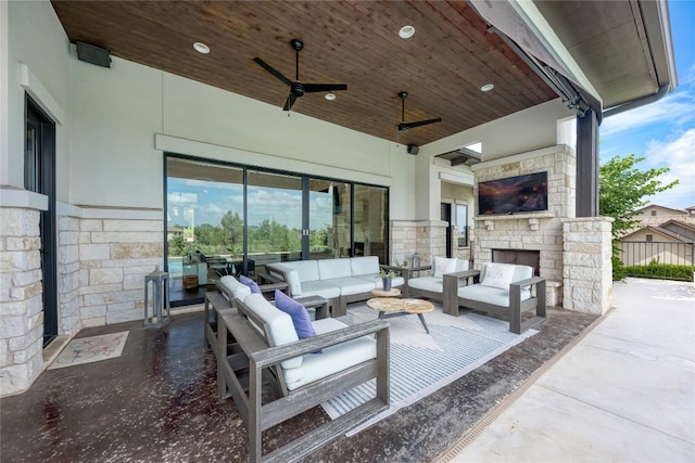 8100 Magnolia Ridge Cv, Austin, TX 78738 - view of patio / terrace with an outdoor living space with a fireplace and ceiling fan
