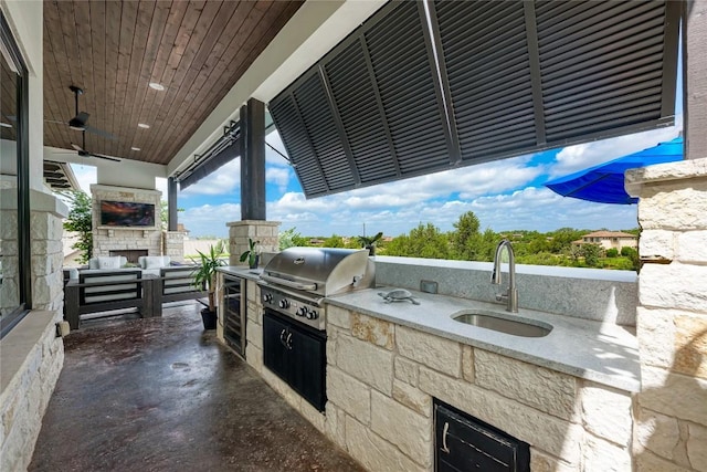 8100 Magnolia Ridge Cv, Austin, TX 78738 - view of patio / terrace featuring a sink, ceiling fan, an outdoor living space with a fireplace, and wine cooler