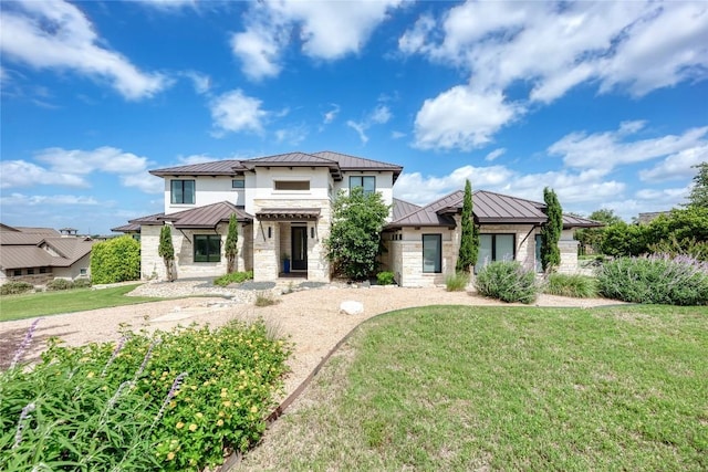 8100 Magnolia Ridge Cv, Austin, TX 78738 - view of front of house featuring a standing seam roof, metal roof, stone siding, and a front yard
