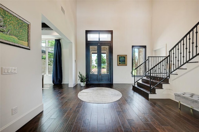 8100 Magnolia Ridge Cv, Austin, TX 78738 - entrance foyer with stairs, wood-type flooring, a high ceiling, and baseboards