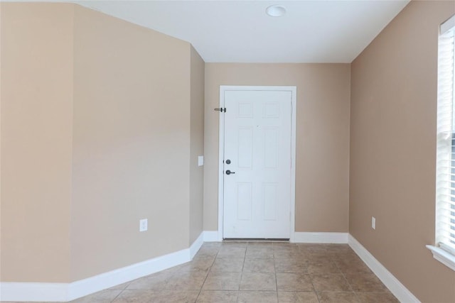 9001 Edmundsbury Dr, Austin, TX 78747 - spare room featuring baseboards and light tile patterned floors