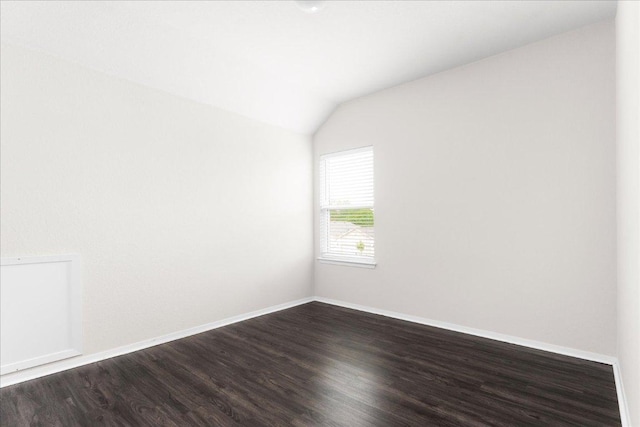 2800 Joe Dimaggio Blvd Unit 100, Round Rock, TX 78665 - spare room with vaulted ceiling and dark wood-type flooring