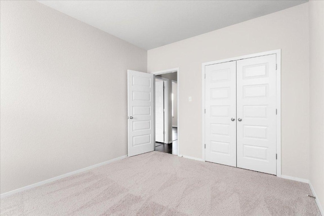 2800 Joe Dimaggio Blvd Unit 100, Round Rock, TX 78665 - unfurnished bedroom featuring carpet floors and a closet