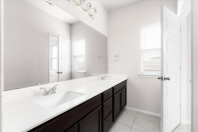 2800 Joe Dimaggio Blvd Unit 100, Round Rock, TX 78665 - bathroom featuring double vanity and tile patterned flooring