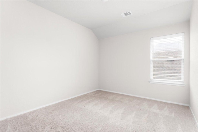 2800 Joe Dimaggio Blvd Unit 100, Round Rock, TX 78665 - empty room featuring carpet floors and vaulted ceiling
