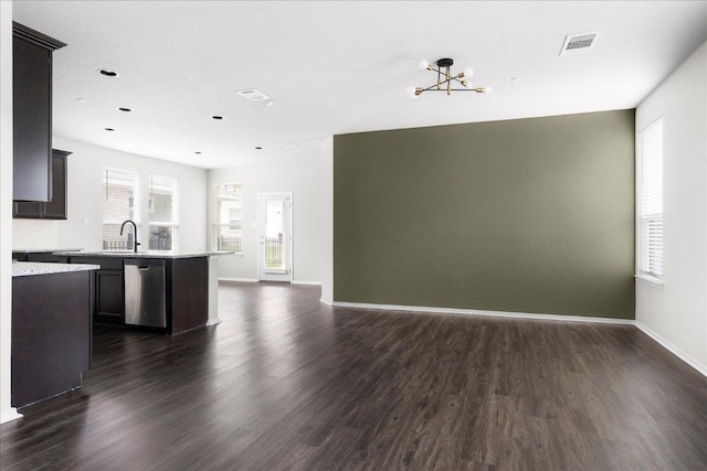 2800 Joe Dimaggio Blvd Unit 100, Round Rock, TX 78665 - kitchen featuring stainless steel dishwasher, dark wood finished floors, and open floor plan