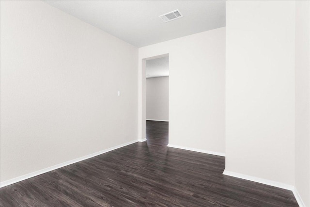 2800 Joe Dimaggio Blvd Unit 100, Round Rock, TX 78665 - spare room featuring dark wood-style floors and baseboards