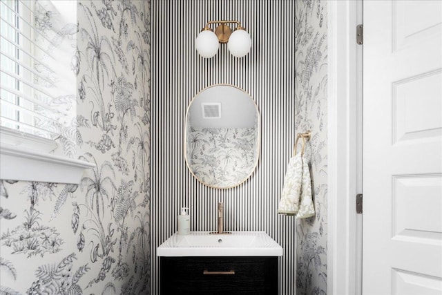2800 Joe Dimaggio Blvd Unit 100, Round Rock, TX 78665 - bathroom with wallpapered walls and vanity