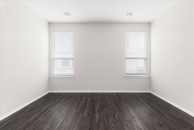 2800 Joe Dimaggio Blvd Unit 100, Round Rock, TX 78665 - unfurnished room with dark wood finished floors and baseboards