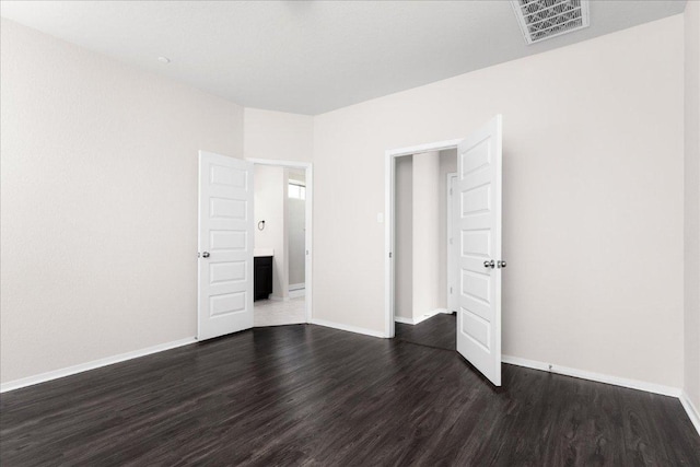 2800 Joe Dimaggio Blvd Unit 100, Round Rock, TX 78665 - unfurnished bedroom with dark wood-style flooring and baseboards