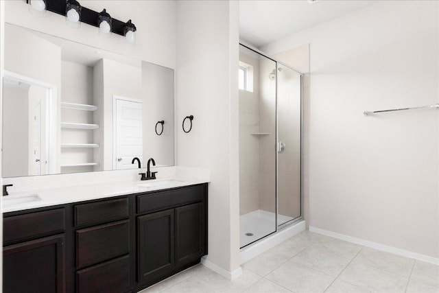 2800 Joe Dimaggio Blvd Unit 100, Round Rock, TX 78665 - bathroom featuring a stall shower, double vanity, and tile patterned floors