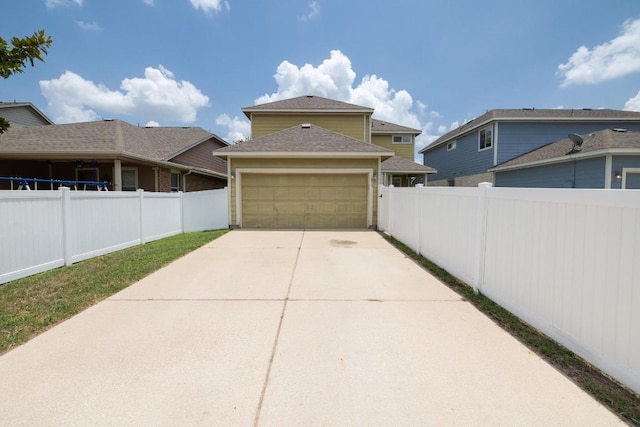 1813 Indian Lodge Dr, Cedar Park, TX 78613 - view of side of home with an attached garage, concrete driveway, and roof with shingles
