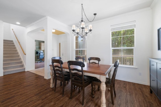 1813 Indian Lodge Dr, Cedar Park, TX 78613 - dining space with a chandelier, dark wood-type flooring, arched walkways, stairs, and ornamental molding