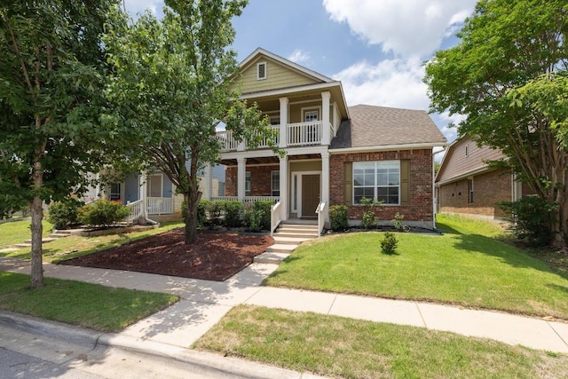 1813 Indian Lodge Dr, Cedar Park, TX 78613 - neoclassical / greek revival house with covered porch, brick siding, a front yard, a balcony, and a shingled roof