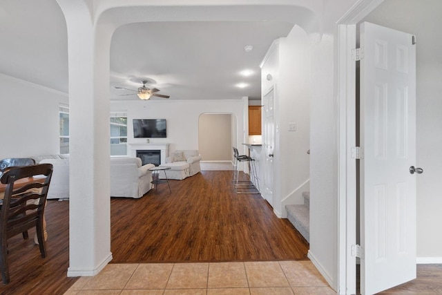 1813 Indian Lodge Dr, Cedar Park, TX 78613 - hallway with light tile patterned floors, arched walkways, and stairs