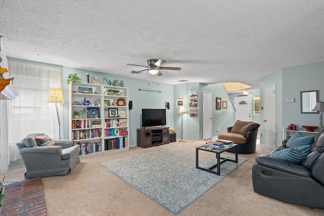 534 Broken Feather Trl, Pflugerville, TX 78660 - living room with ceiling fan, carpet floors, and a textured ceiling