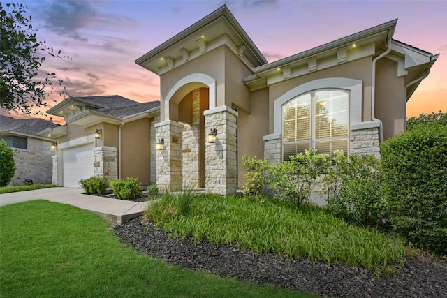 104 Blue Agave Ln, Georgetown, TX 78626 - view of front of home with stone siding, stucco siding, a garage, and concrete driveway