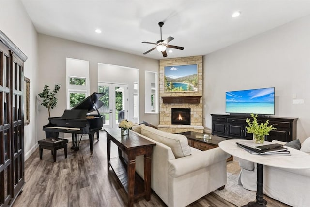 104 Blue Agave Ln, Georgetown, TX 78626 - living room with french doors, ceiling fan, wood finished floors, recessed lighting, and a stone fireplace