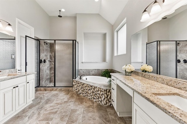 104 Blue Agave Ln, Georgetown, TX 78626 - full bathroom featuring two vanities, a shower stall, a bath, and vaulted ceiling