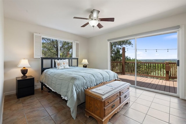 108 Highlander St, Lakeway, TX 78734 - bedroom featuring access to outside, multiple windows, light tile patterned floors, and ceiling fan