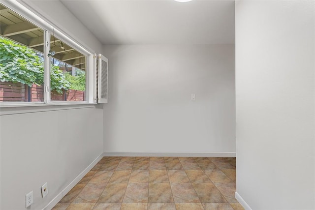 108 Highlander St, Lakeway, TX 78734 - empty room with baseboards and stone finish flooring