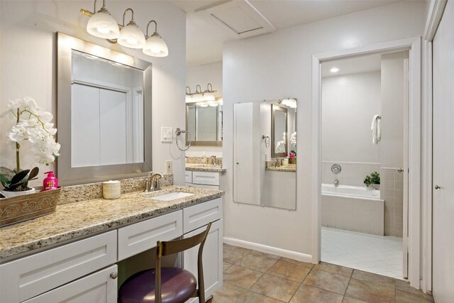 108 Highlander St, Lakeway, TX 78734 - full bathroom with vanity, tile patterned flooring, a bath, and baseboards