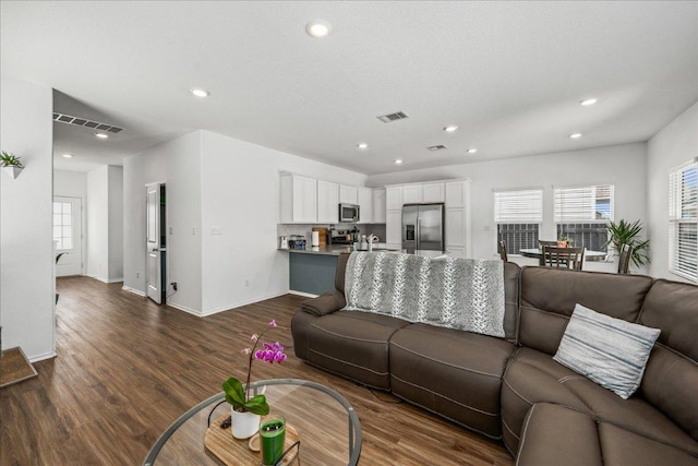 1725 Cobblecrest Ln, Leander, TX 78641 - living area with dark wood-type flooring and recessed lighting