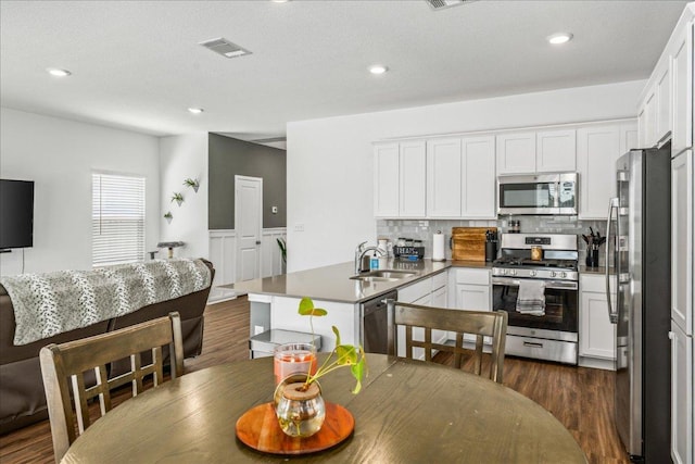1725 Cobblecrest Ln, Leander, TX 78641 - dining area featuring dark wood-type flooring and recessed lighting
