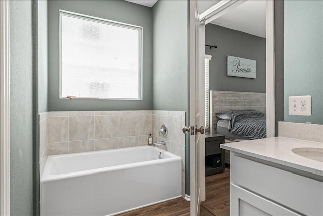 1725 Cobblecrest Ln, Leander, TX 78641 - full bathroom featuring wood finished floors, a garden tub, and vanity