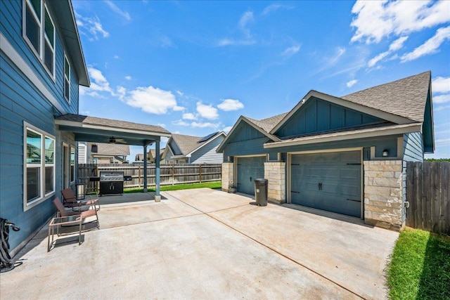 1725 Cobblecrest Ln, Leander, TX 78641 - garage with concrete driveway and a ceiling fan