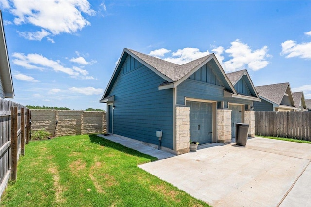 1725 Cobblecrest Ln, Leander, TX 78641 - view of side of home featuring board and batten siding, roof with shingles, a patio area, and a fenced backyard