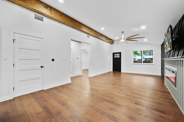 1006 Chericoo St, Austin, TX 78702 - unfurnished living room with a ceiling fan, wood finished floors, recessed lighting, and baseboards