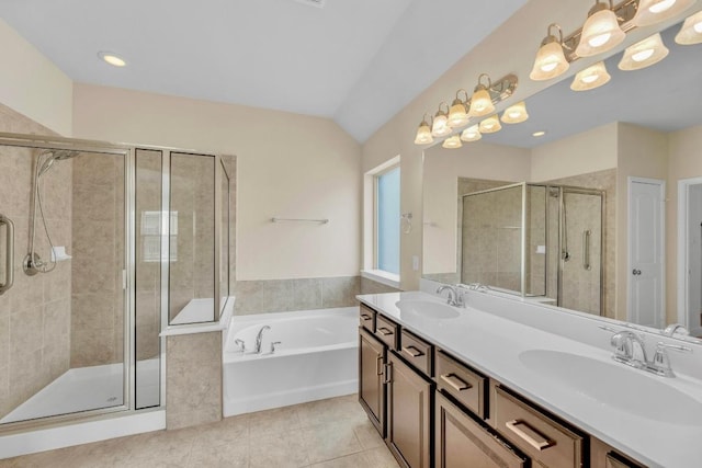 3546 Guadalajara St, Round Rock, TX 78665 - bathroom with double vanity, a shower stall, a bath, and tile patterned flooring