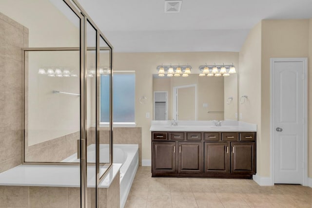 3546 Guadalajara St, Round Rock, TX 78665 - full bath with a garden tub, double vanity, tile patterned floors, and a shower stall