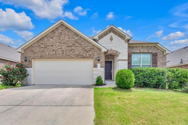 3546 Guadalajara St, Round Rock, TX 78665 - french country style house with stone siding, concrete driveway, a garage, and a front yard