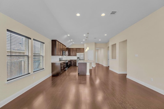 3546 Guadalajara St, Round Rock, TX 78665 - living room featuring dark wood-style floors, arched walkways, lofted ceiling, and recessed lighting