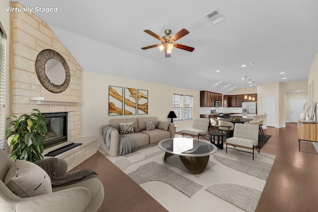3546 Guadalajara St, Round Rock, TX 78665 - living room featuring wood finished floors, a ceiling fan, a fireplace, lofted ceiling, and recessed lighting